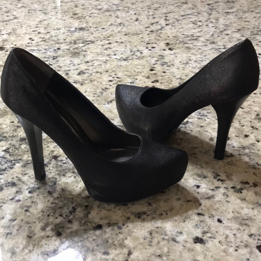 Black pointed toe pumps